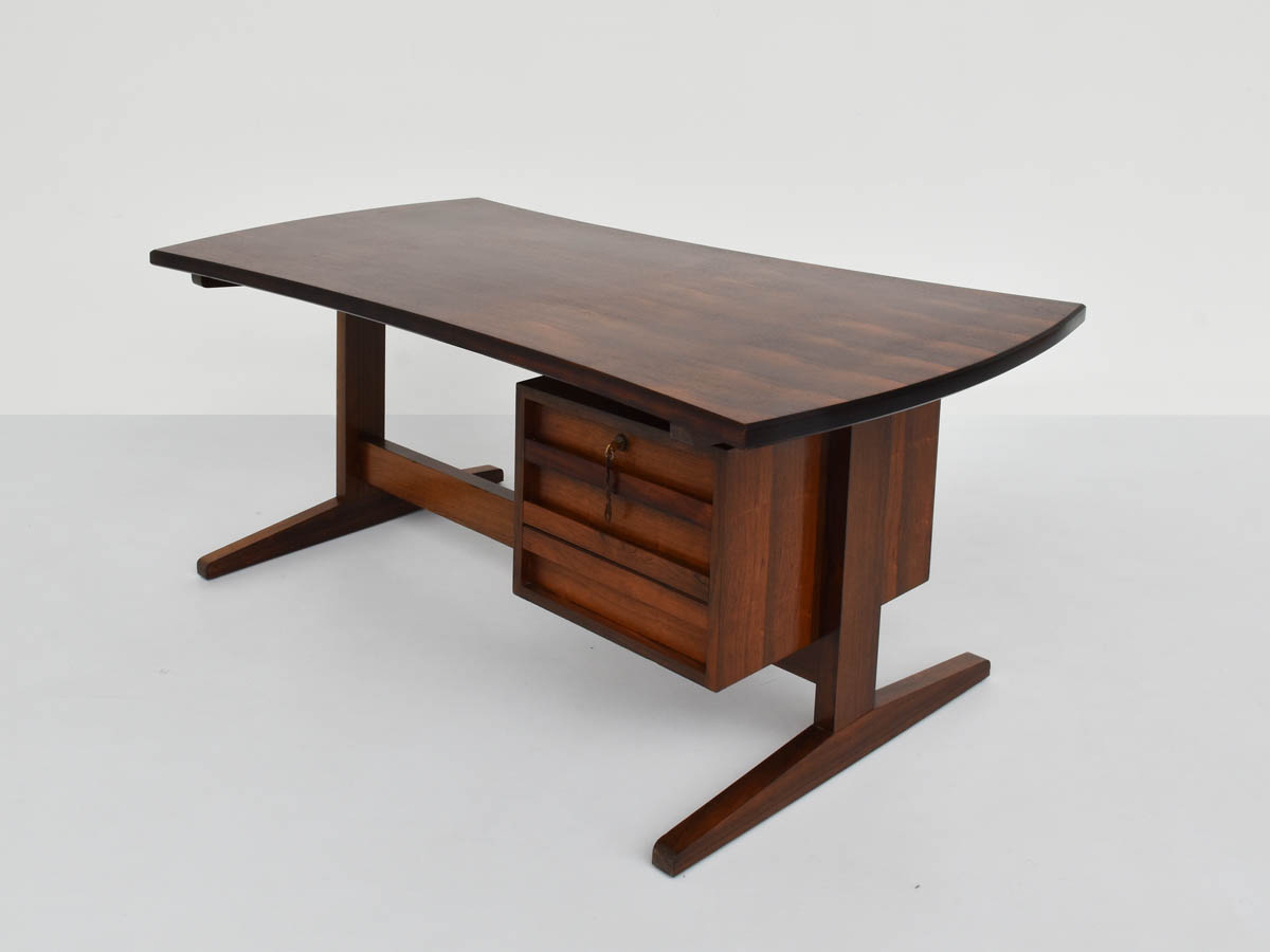 Desk with convex bumerang top in rosewood