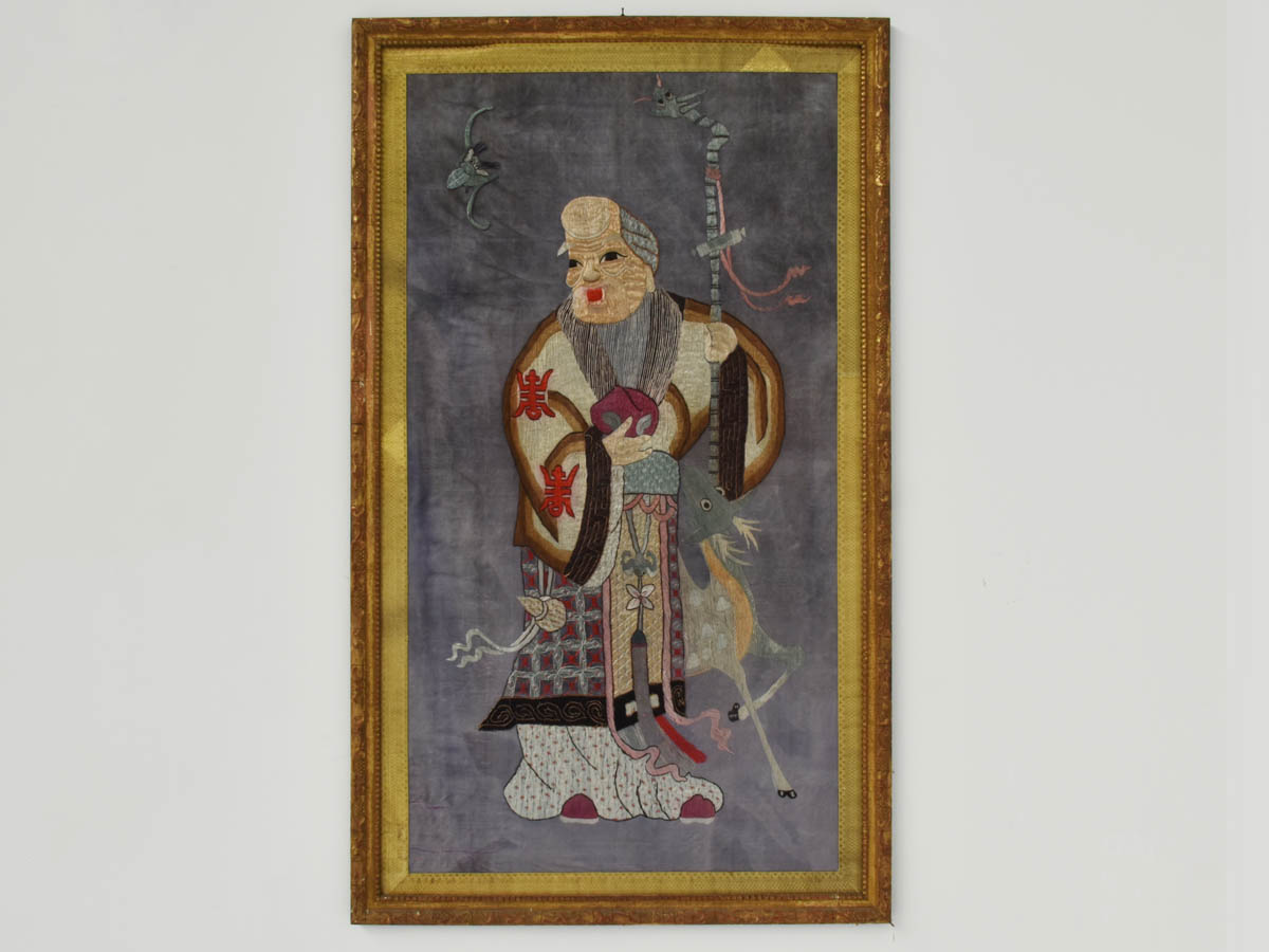 Chinese embroidered silk textile of a wise man and magic animals