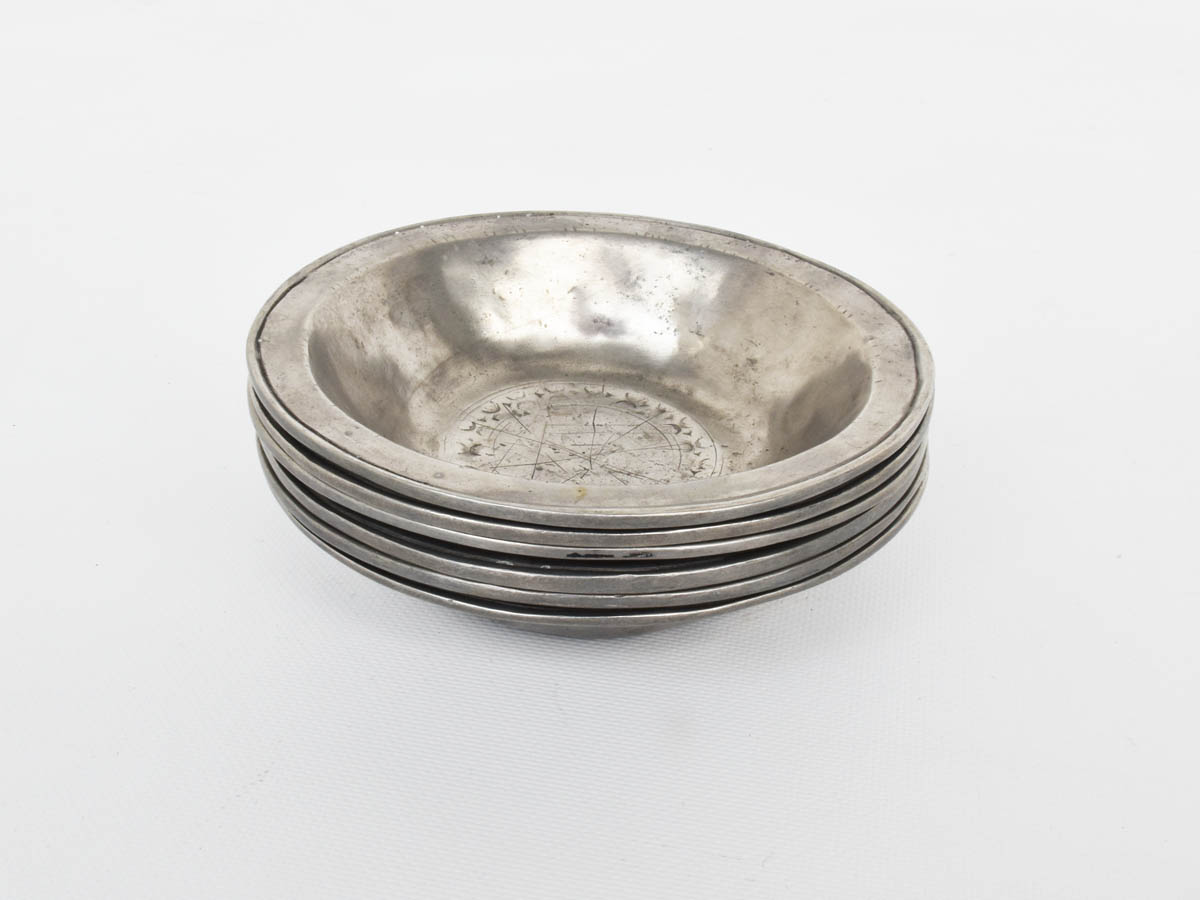 Hammer-worked bowls in solid pewter bowls decorated with runes, 1600 Great Britain, Set of 6