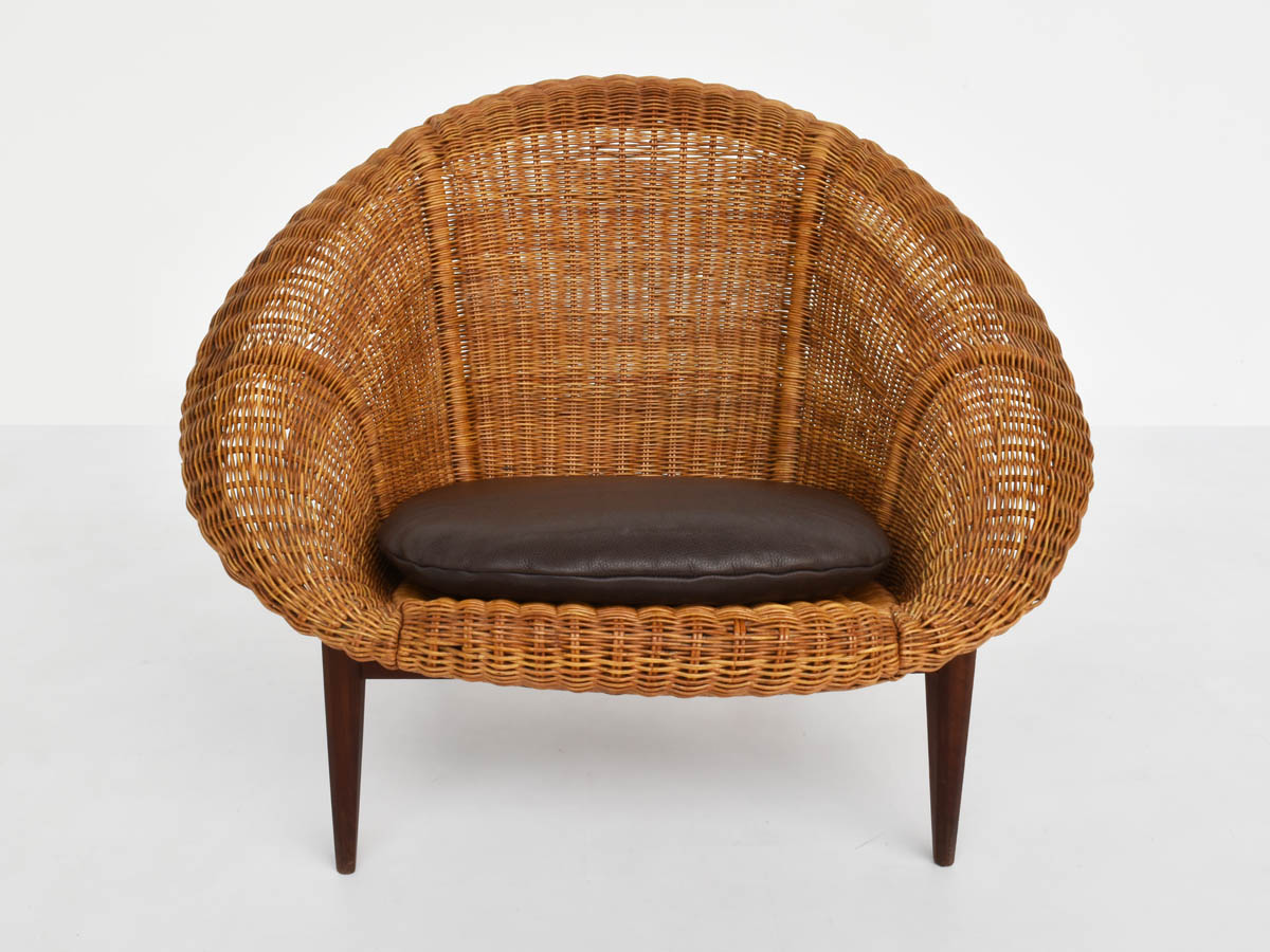 Large woven rush armchair with leather cushion